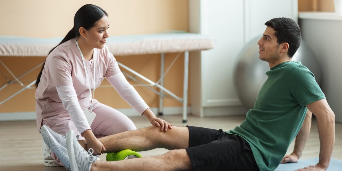 doctor-helping-patient-rehabilitation